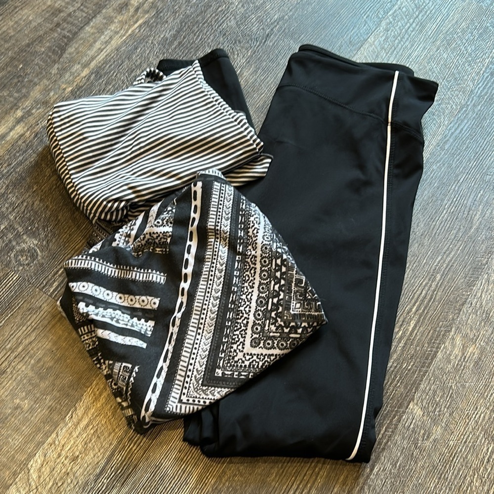 Set of 3. 1 Fabletics pants small and 2 Prana shirts size S and sp workout gear